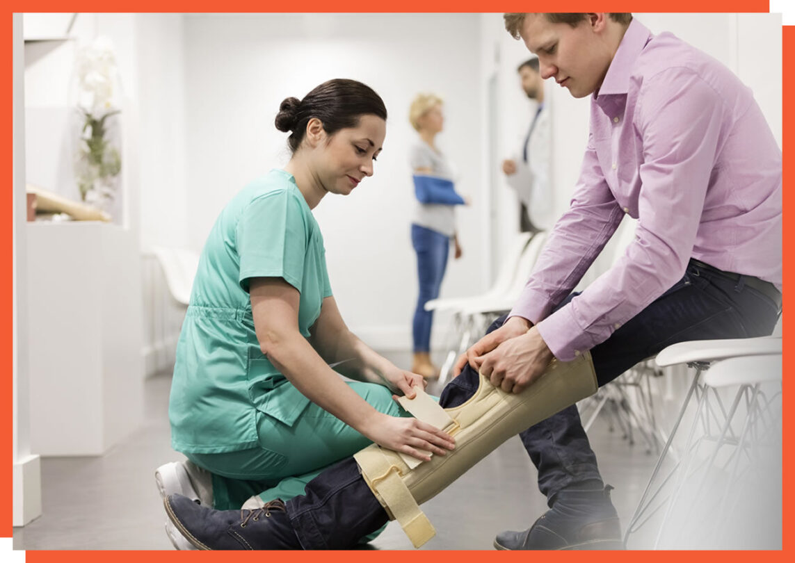 Physiotherapist assisting a patient with a knee brace
